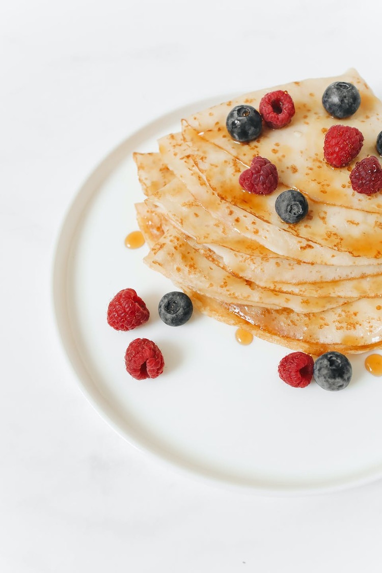 Crepes with Sweet Raspberries, Blueberries and Honey