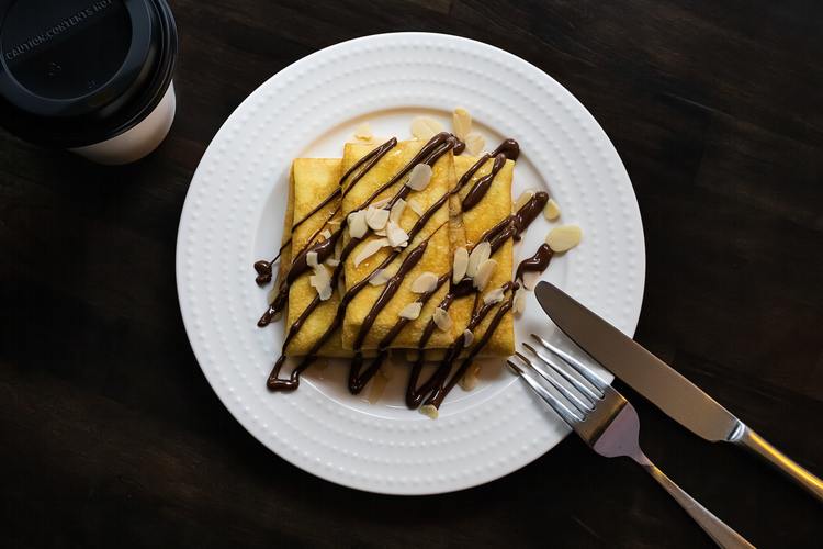 Crepes with Chocolate Syrup and Almond Slivers